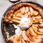 Easy Apple Pie Served Directly in Cast Iron Skillet along with a scoop of ice cream.