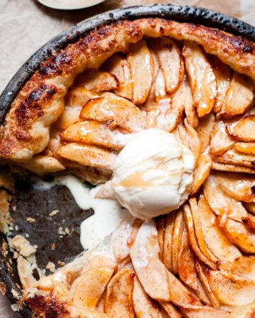 Easy Apple Pie Served Directly in Cast Iron Skillet along with a scoop of ice cream.